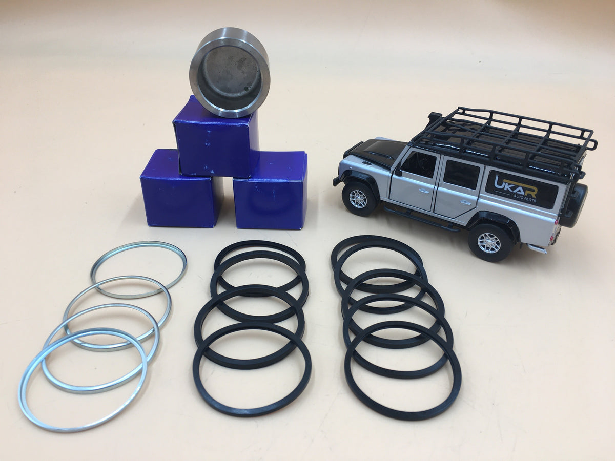 LR DEFENDER 94- Front Caliper Repair Kit Contains Four Pistons STC1280