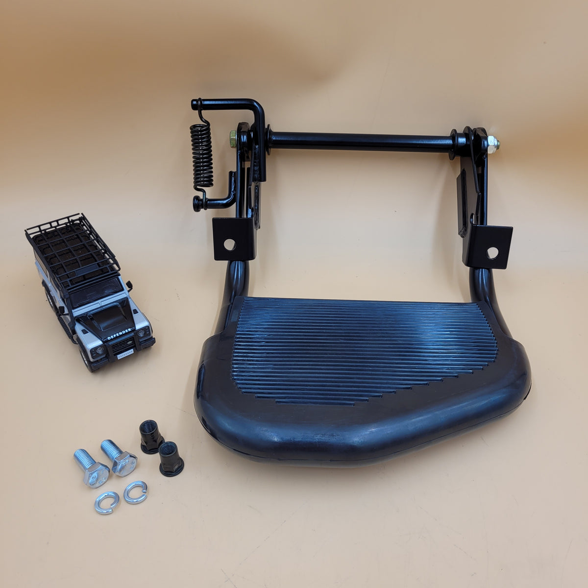 LR DEFENDER -16 SINGLE FOLD UP RUBBER TOPPED BLACK REAR STEP STC7632