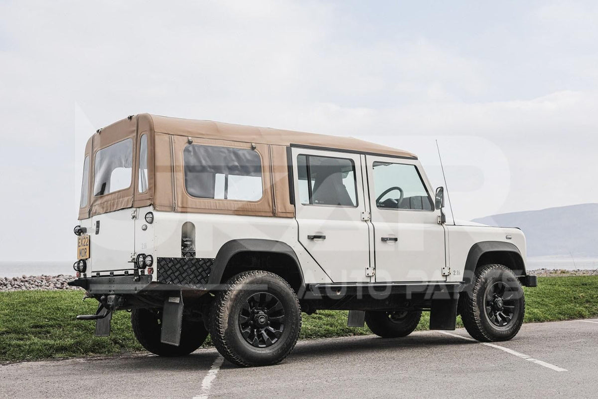 Defender 110 with sand mohair soft top fitted