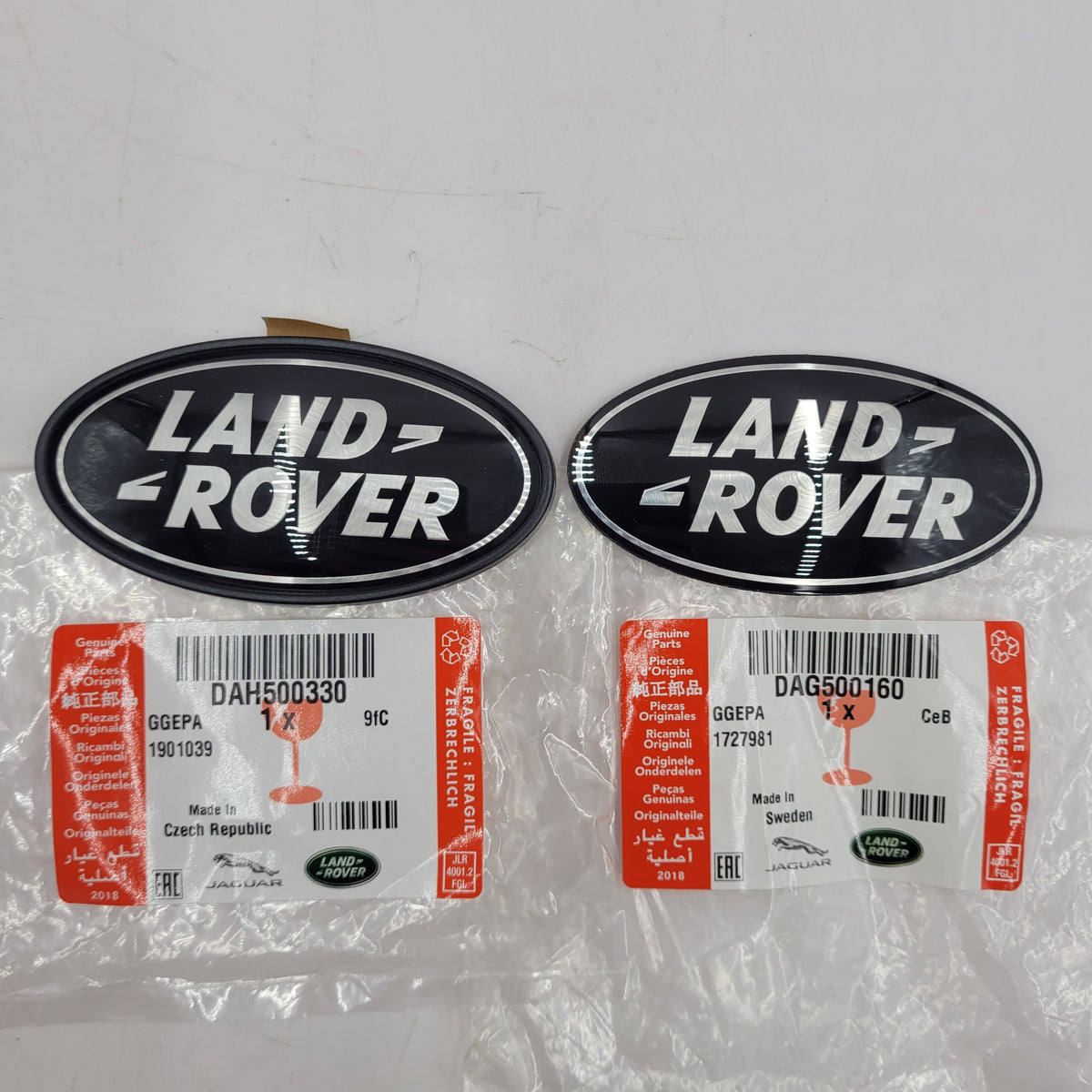 LAND ROVER OVAL BADGES BLACK ON SILVER GENUINE PARTS DAG500160 AND DAH500330