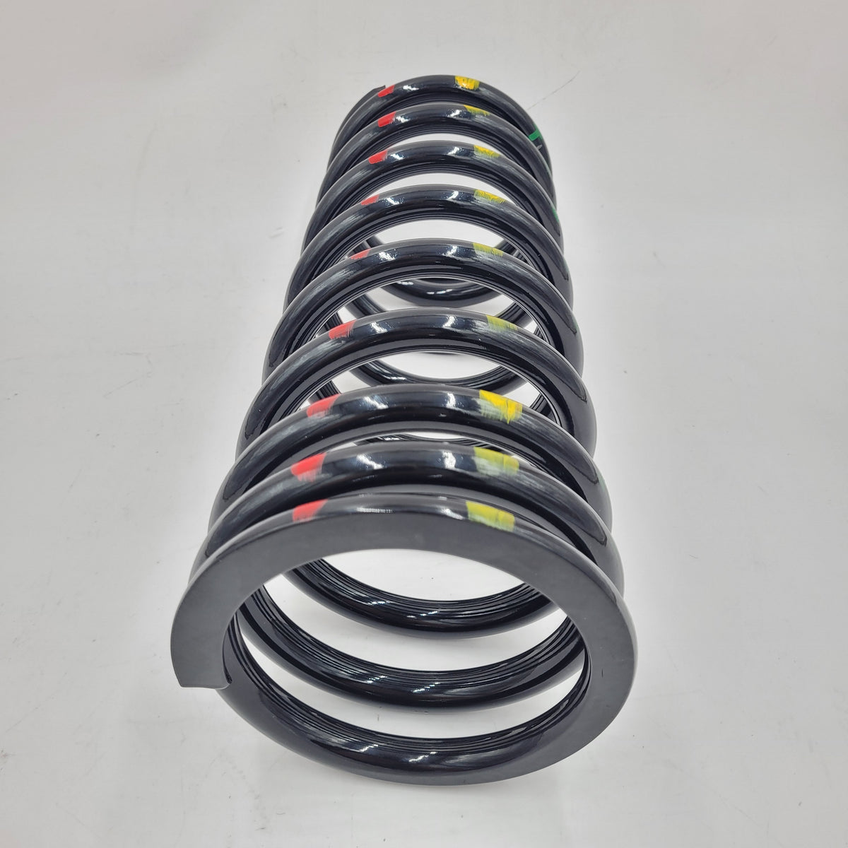 LR DEFENDER 90' Rear Driver Coil Spring (Green/Red/Yellow) Part RKB101230