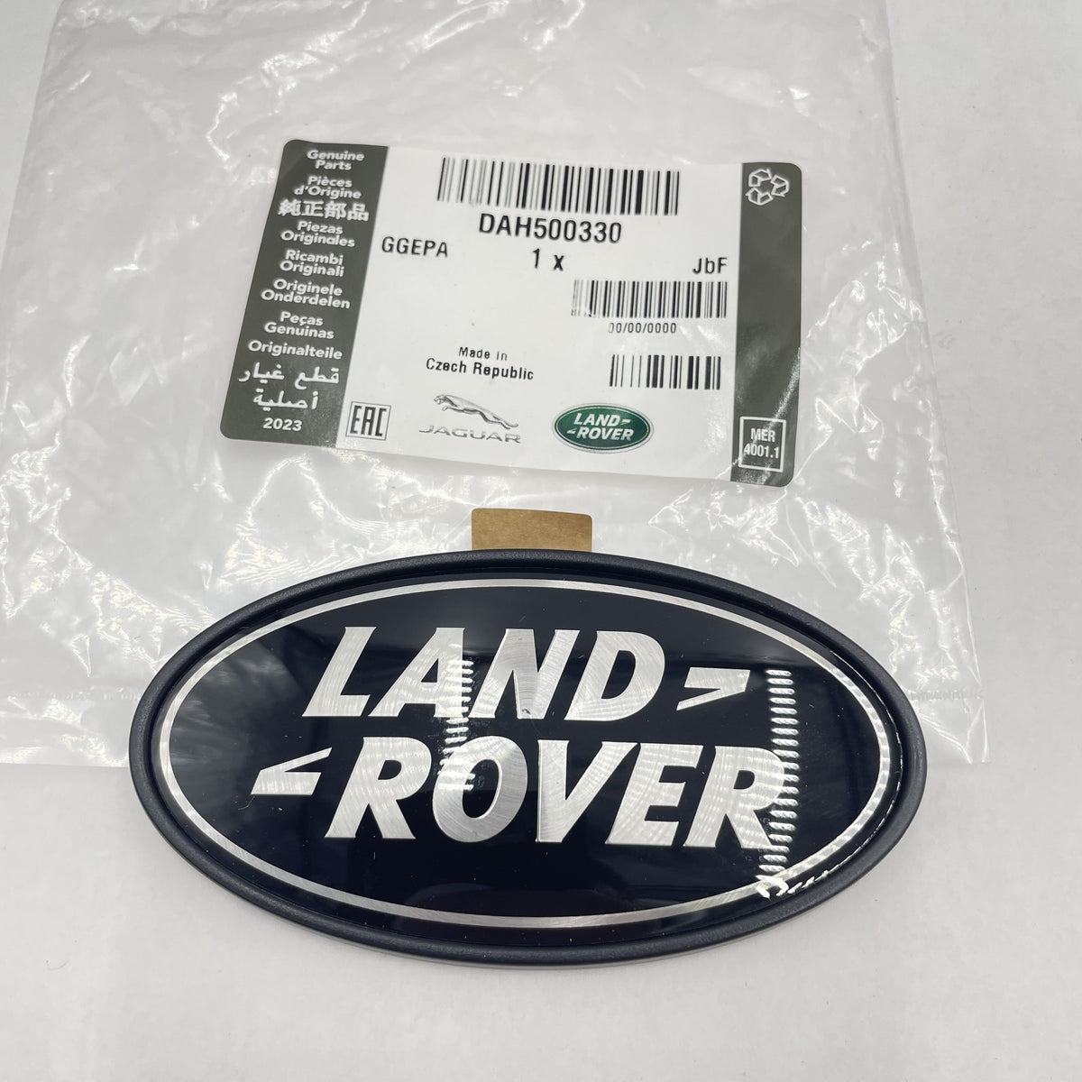 LAND ROVER LOGO REAR BODY OVAL BADGE BLACK ON SILVER GENUINE PART DAH500330