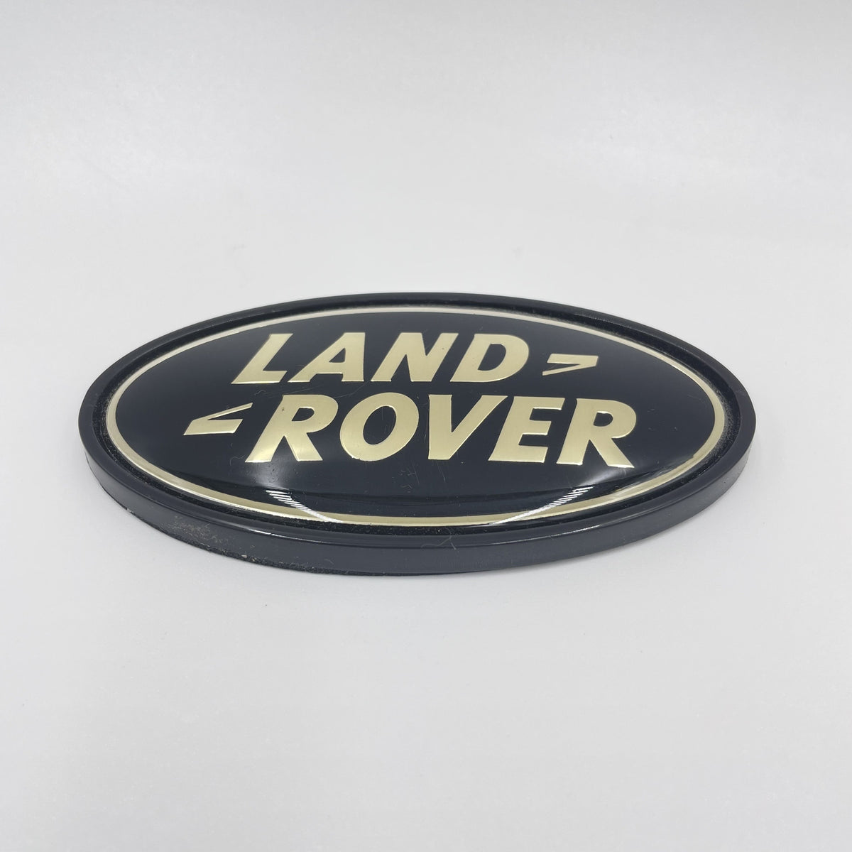 LAND ROVER LOGO REAR BODY OVAL BADGE BLACK ON SILVER GENUINE PART DAH500330